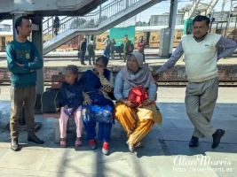 People waiting for a train at the train station in Rajpura, Punjab.