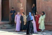 Indian ladies gathered in a courtyard of the Jahangiri Mahal.