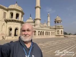 Alan Morris on the grounds of the Bara Imambara with the Asfi Mosque behind him. Alan Morris on the grounds of the Bara Imambara with the Asfi Mosque behind him.