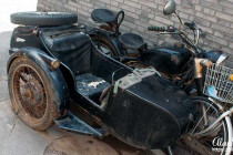 Motorbike & sidecar parked outside a home in the Beijing Hutongs.