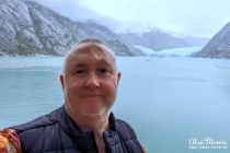 Alan Morris on the NCL Spirit in the Endicott Arm, in front of Dawes Glacier