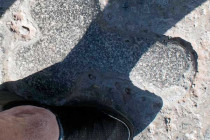 A stone penis in the cobbled street of Pompeii