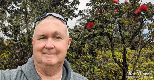 Alan Morris in front of a flowering shrub by the Steam vents near the Kilauea Visitor Centre. Alan Morris in front of a flowering shrub by the Steam vents near the Kilauea Visitor Centre.